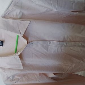 Cream colored long sleeve button up ladies